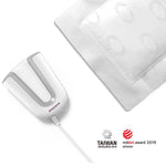 White appliance with a cable and a white mat on a white background, featuring Taiwan Excellence and Red Dot Award logos.