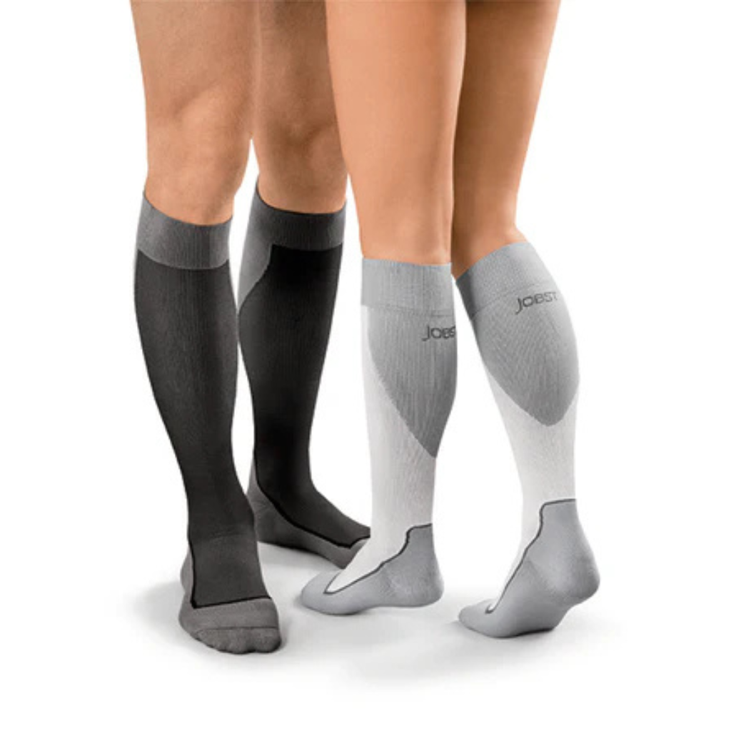 Two pairs of knee-high socks, one black and one gray with white accents, on a plain background.