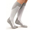Gray knee-high socks worn by a person on a white background
