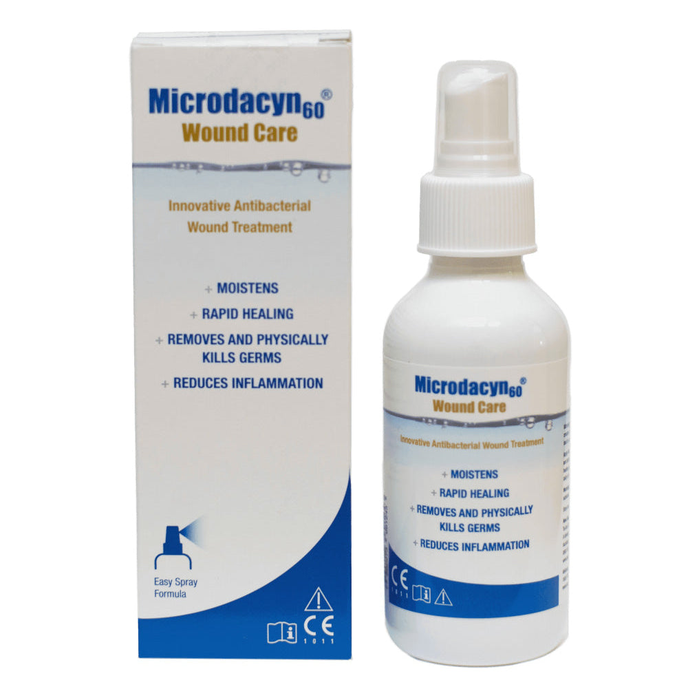 Packaging of Microdacyn Hydrogel wound care product, showing a white box with blue and red text and images, alongside a spray bottle dispenser.